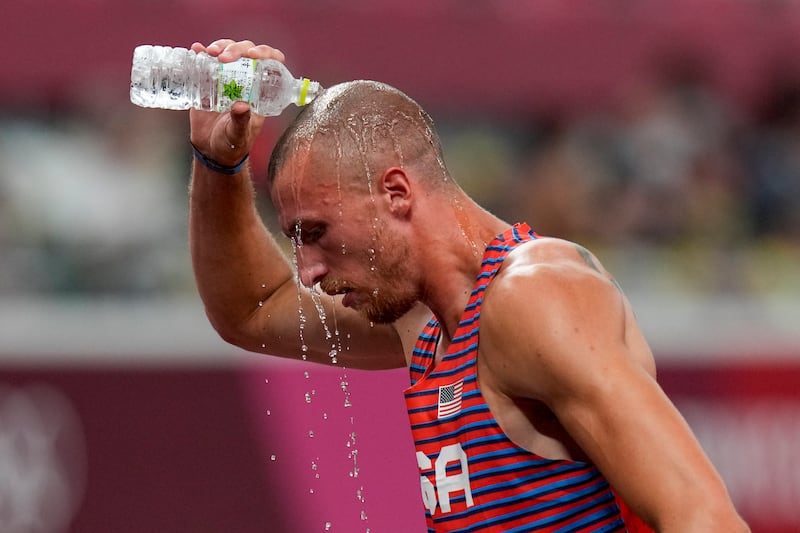 Zachery Ziemek, of the U.S., cools off after a heat of the men’s decathlon 400 meters at the 2020 Summer Olympics in Tokyo.