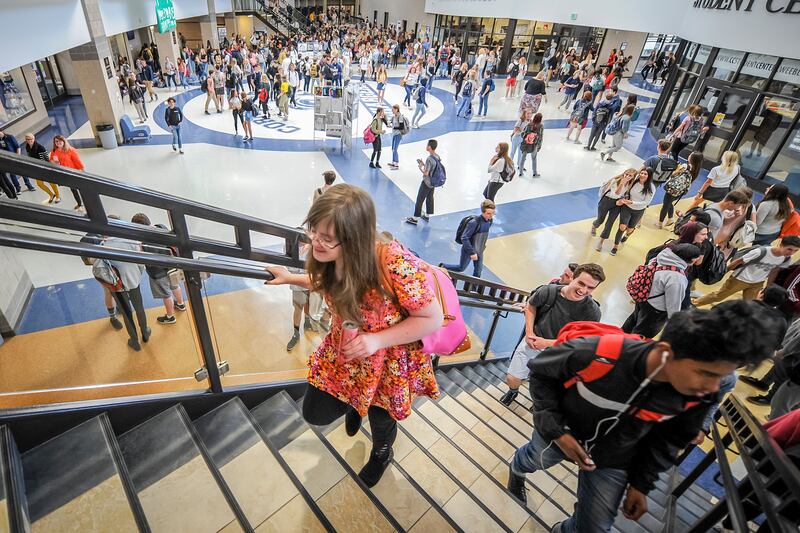 Emily Arthur climbs the stairs to get to her class after lunch at Corner Canyon High School in Draper on Thursday, April 26, 2018.