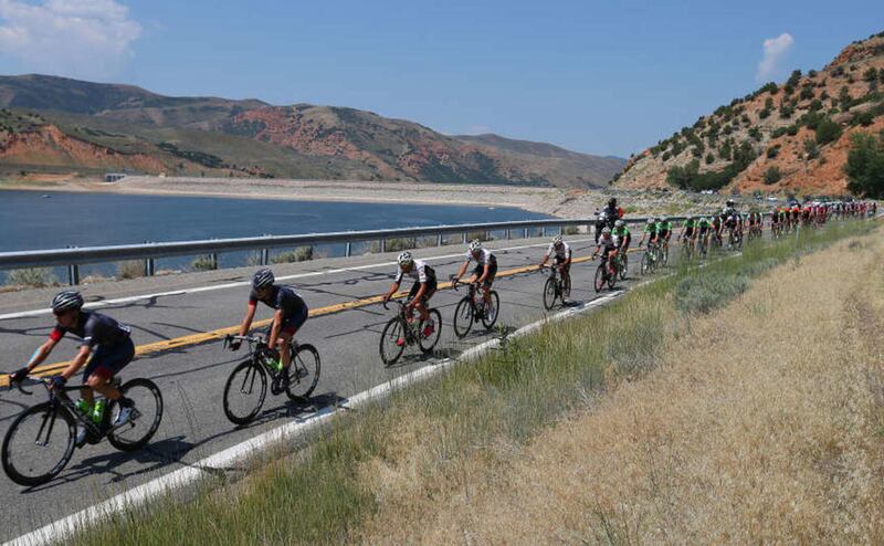 Peloton travels through along Echo Reservoir during Stage 6 of the "Tour of Utah" bike race Saturday, Aug. 9, 2014, near Coalville.