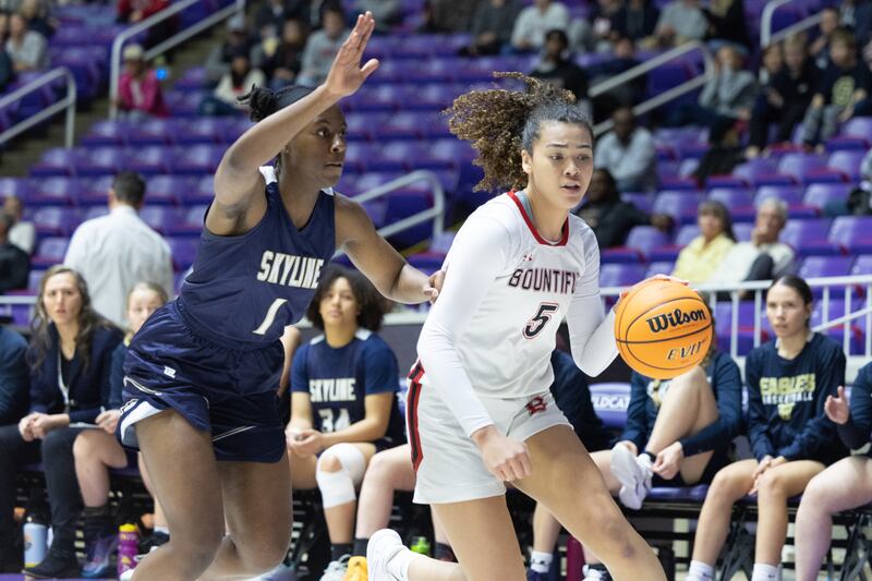 A Bountiful player drives to the hoop.