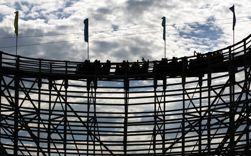 Thrill seekers make the first turn on the wooden roller coaster at the Lagoon Amusement Park in Farmington Saturday, July 30, 2005.