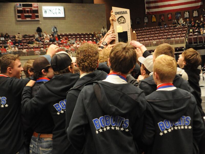 Panguitch High School wrestling accepts the 2022 state 1A wrestling trophy at the Sevier Valley Center.
