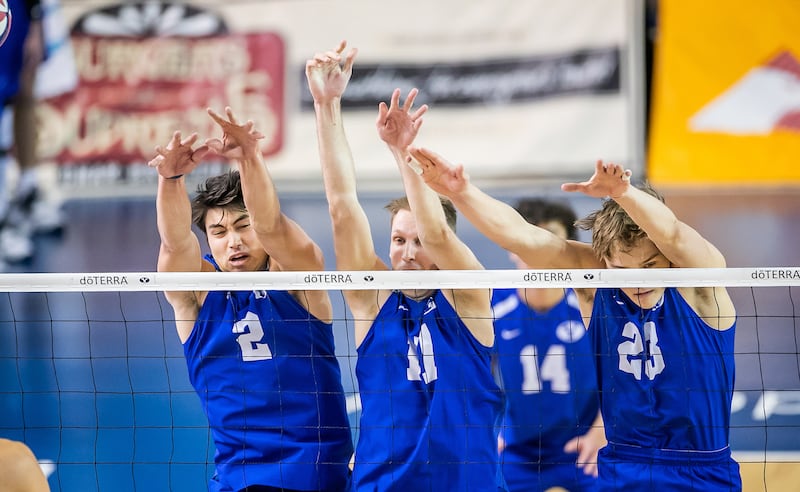 A trio of BYU players rise for a block during match against UC Irvine on Jan. 22, 2022, at Smith Fieldhouse in Provo.