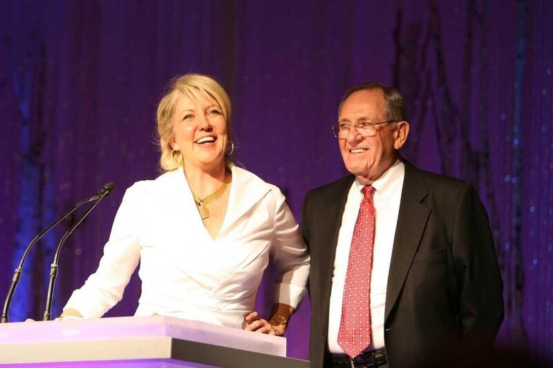 Laura Hadley, executive director of the Utah chapter of the Cystic Fibrosis Foundation, presents Mac Christensen, founder of the Mr. Mac clothing store chain, with the organization's Breath of Life Award. Christensen was recognized for his humanitarian ef
