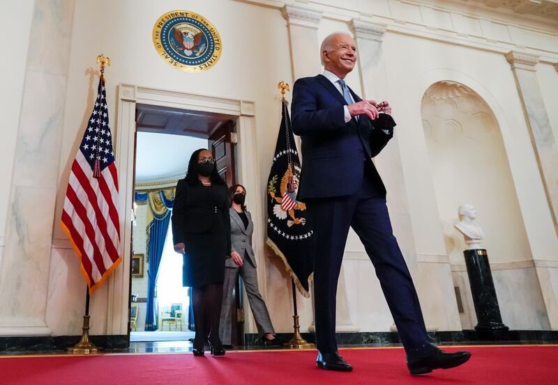 President Joe Biden, right, arrives with Vice President Kamala Harris and Judge Ketanji Brown Jackson.