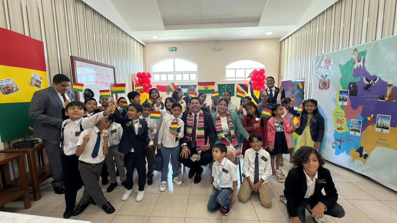 Primary children of the Samborondón Ecuador Stake pose for a photo with the Bolivian flag during the stake's mini missionary training center activity in Guayaquil, Ecuador, Feb. 21, 2026.