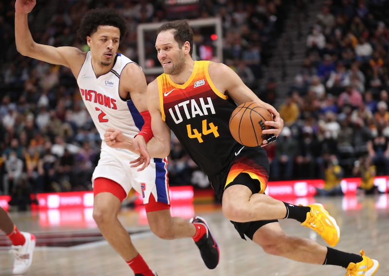 Utah Jazz forward Bojan Bogdanovic (44) drives on Detroit Pistons guard Cade Cunningham (2) in Salt Lake City on Friday, Jan. 21, 2022.