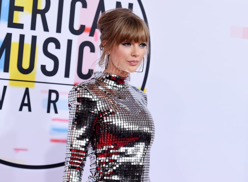 In this Oct. 9, 2018, file photo, Taylor Swift arrives at the American Music Awards at the Microsoft Theater in Los Angeles.