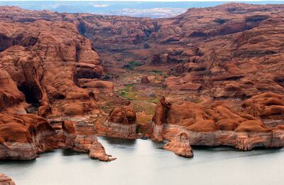 FILE - A view of Lake Powell above the Hole in the Rock on Aug. 21, 2003. Author Wallace Stegner's "The Sound of Mountain Water" includes descriptions of the "serenely beautiful" Glen Canyon (located in southeastern Utah) of the past.