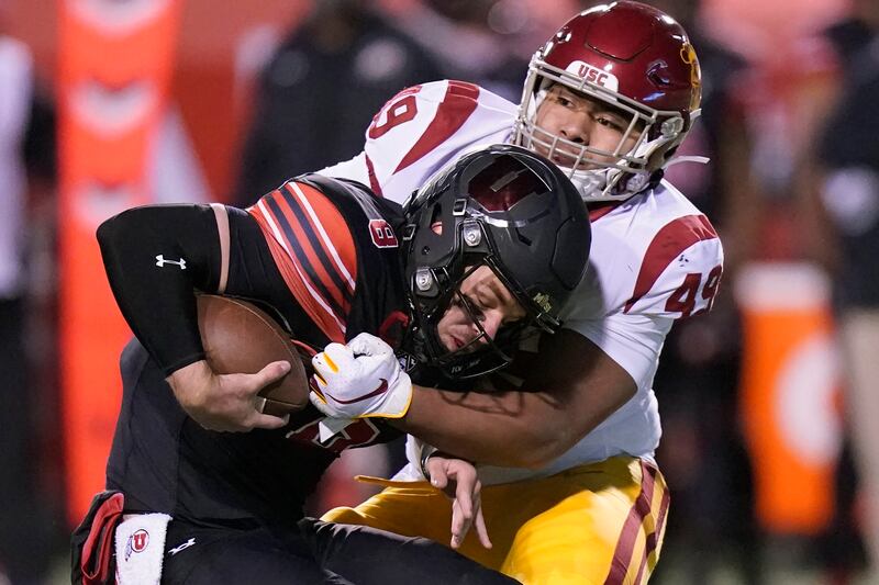 USC defensive lineman Tuli Tuipulotu sacks Utah quarterback Jake Bentley in a game Nov. 21, 2020, in Salt Lake City.