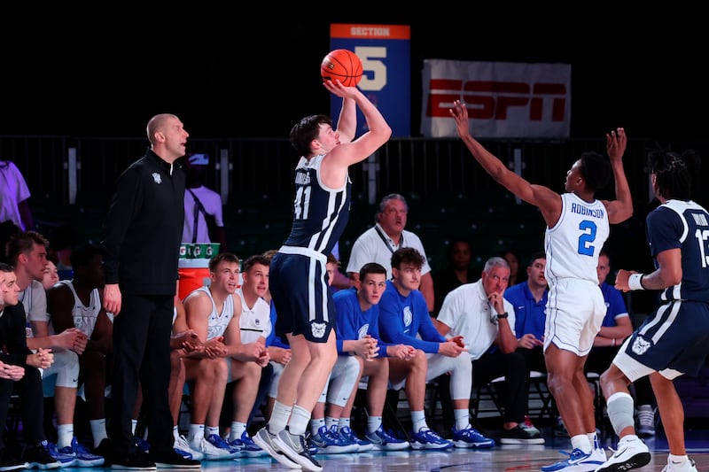 Butler’s Simas Lukosius shoots as BYU’s Jaxson Robinson (2) defends during a game in the Battle 4 Atlantis at Paradise Island, Bahamas, Thursday, Nov. 24, 2022.