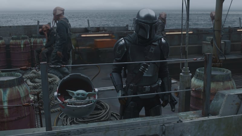 The Child and the Mandalorian in “The Mandalorian.”