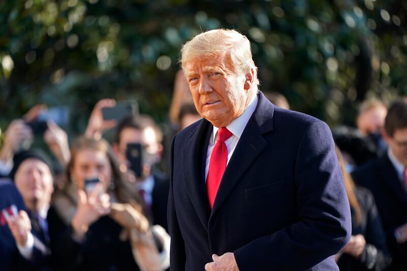 President Donald Trump walks to board Marine One on the South Lawn of the White House, Tuesday, Jan. 12, 2021, in Washington. The President is traveling to Texas.