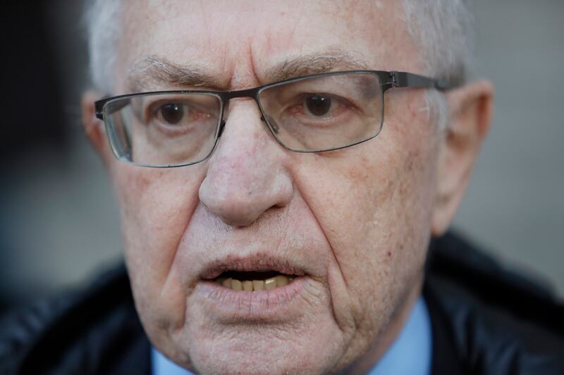 Attorney Alan Dershowitz speaks during a 2019 news interview outside of Manhattan Federal Court in New York.