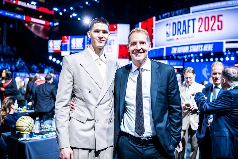 Egor Demin poses for a picture with Travis Hansen after being selected No. 8 overall in the NBA draft by the Brooklyn Nets Wednesday, June 25, 2025.