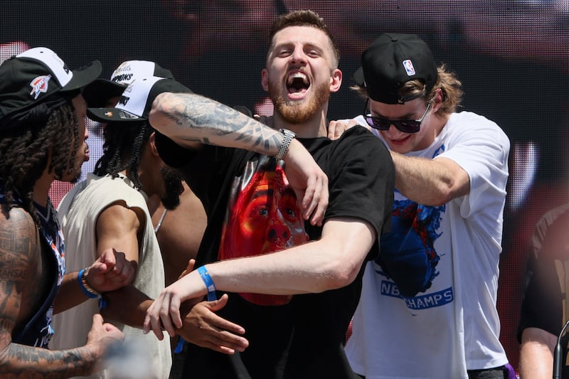Oklahoma City Thunder center Isaiah Hartenstein reacts in front of center Branden Carlson during a celebration of the Thunder's NBA basketball championship Tuesday, June 24, 2025, in Oklahoma City.