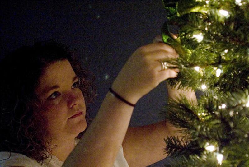 Christina Ashby decorates one of Covenant Communications' Festival of Trees entries.