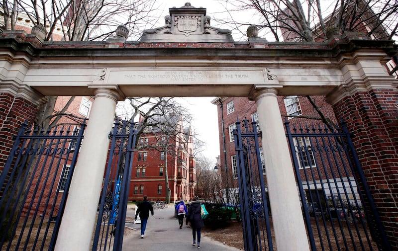 People walk to Harvard Yard.