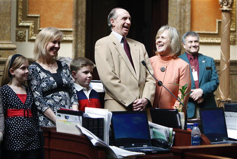Clark Hinckley, center, and wife Kathleen, son and daughter-in-law of the late LDS Church President Gordon B. Hinckley, share a laugh at the state Capitol on Tuesday. They were joined at the Capitol by President Hinckley's granddaughter Celia Benson, left