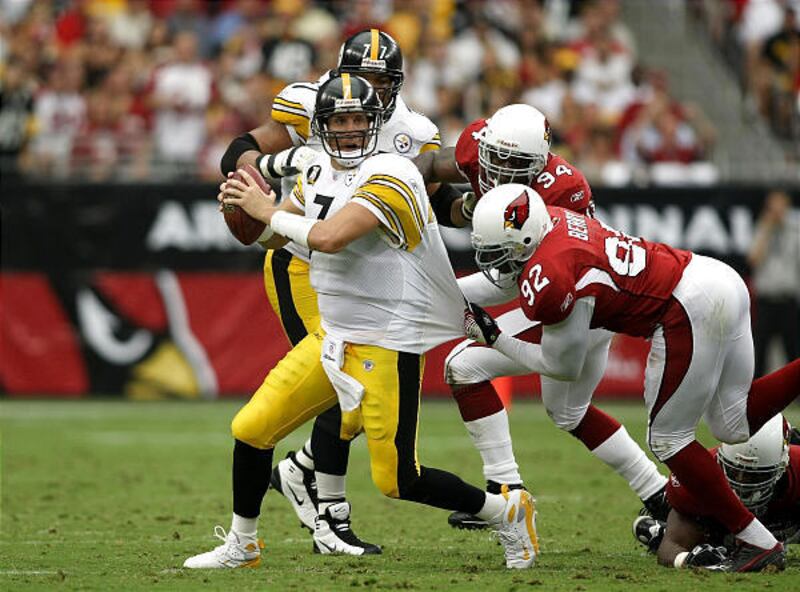 Pittsburgh quarterback Ben Roethlisberger attempts to elude the tackle of Bertrand Berry during the Cardinals' victory over the Steelers on Sunday in Arizona.
