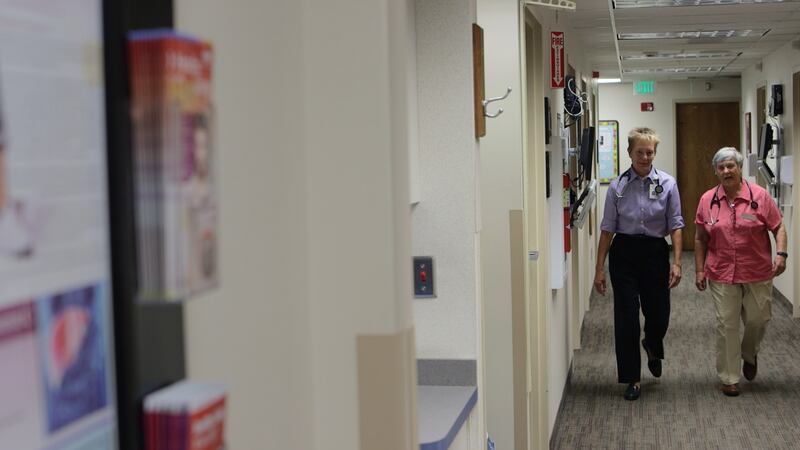 Physician assistant Maggie Snyder and Dr. Kristen Ries in the hallway of their former practice, Clinic 1A at the University of Utah. Reis and Snyder are the subject of the Sundance documentary "Quiet Heroes."