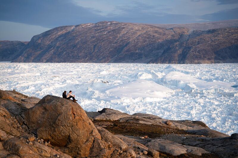 NYU student researchers at the Helheim glacier in Greenland.