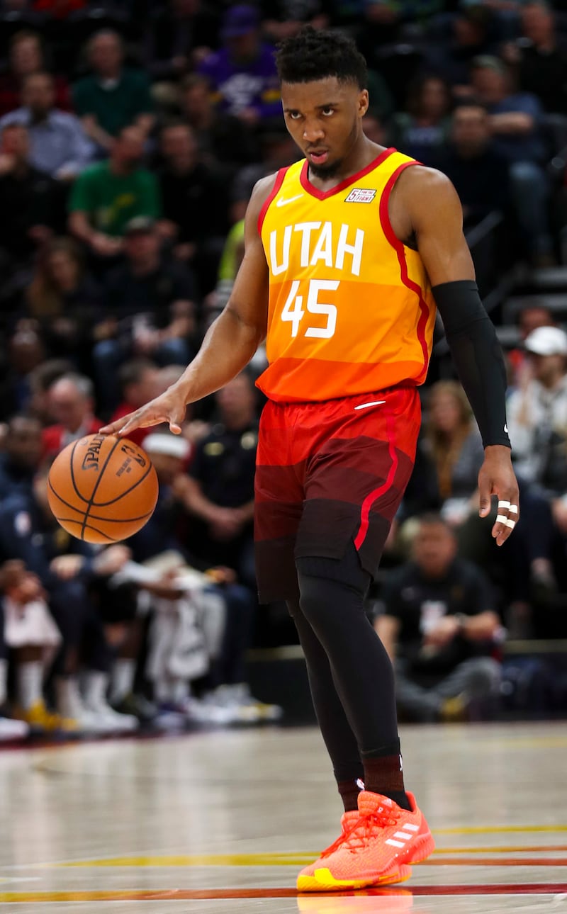 Utah Jazz guard Donovan Mitchell (45) stares down the Denver defense during the Utah Jazz versus Denver Nuggets NBA game at Vivint Arena in Salt Lake City on Tuesday, April 9, 2019.