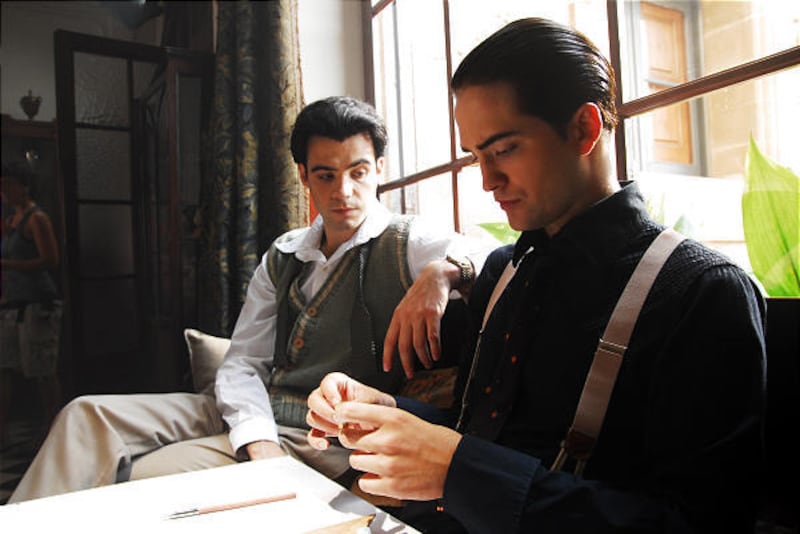 Javier Beltran as Federico Garcia Lorca sitting with Robert Pattinson as Salvador Dali in "Little Ashes."