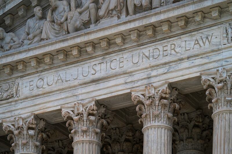 The west facade of the Supreme Court Building bears the motto “Equal Justice Under Law,” in Washington.