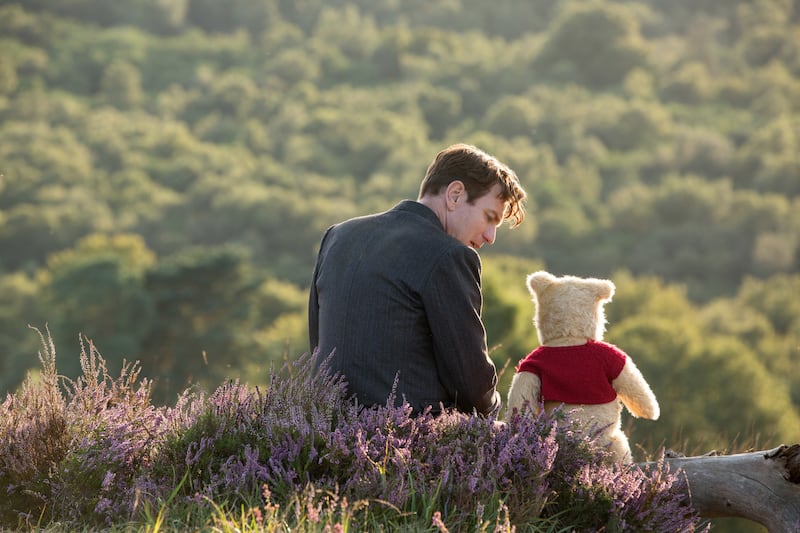 Christopher Robin (Ewan McGregor) with his long time friend Winnie the Pooh in Disney’s live-action adventure “Christopher Robin.”
