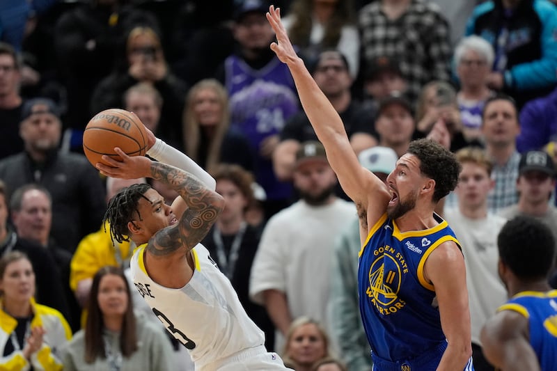Golden State Warriors guard Klay Thompson defends against Utah Jazz guard Keyonte George during game.