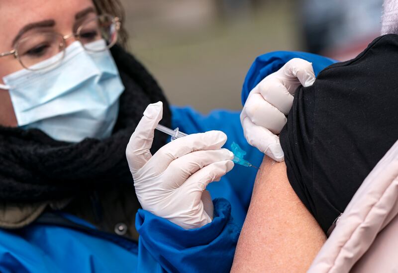 Nursing staff administer flu vaccines to high risk group patients, outdoors to prevent the spread of the coronavirus, in Trelleborg, southern Sweden, Thursday, Nov. 19, 2020.