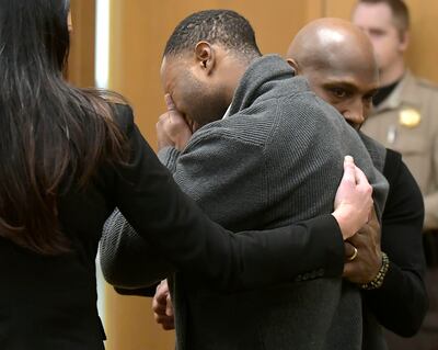 Torrey Green cries while being consoled by defense attorney Skye Lazaro, left, and private investigator E. Christian Warmsley as a jury finds him guilty of eight charges, including five counts of rape and one charge of sexual battery, in Brigham City's 1s