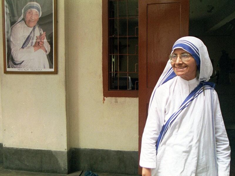 Sister Nirmala, Superior-General of the Missionaries of Charity, stands before a portrait of Mother Teresa at Mother House, headquarters of the order, in Calcutta Wednesday, Aug. 12, 1998.