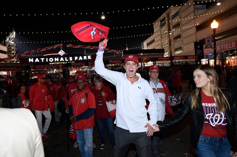 Washington Nationals fans celebrate outside Nationals Park on Tuesday, Oct. 15, 2019.