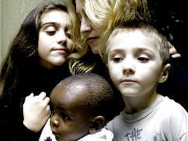 Madonna with daughter Lourdes, left, son Rocco, right, and adopted son David Banda, 13 months.