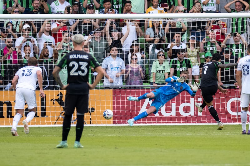 Austin FC forward Sebastian Driussi (7) scores a goal on a free kick against goalkeeper Zac MacMath, third from left, during the second half an MLS playoff soccer match, Sunday, Oct. 16, 2022, in Austin, Texas.