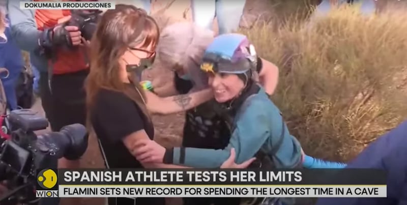 Beatriz Flamini, pictured in a video screenshot, emerges from a Spanish cave.