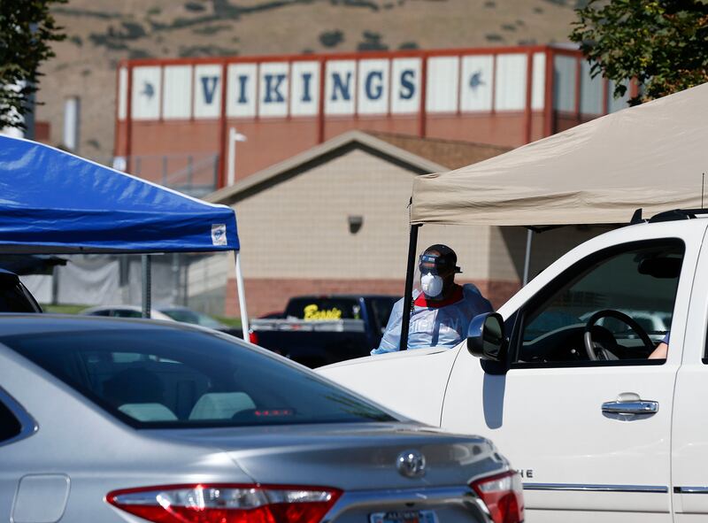 People wait in their vehicles for a COVID-19 test at Pleasant Grove Recreation Center on Wednesday, Sept. 2, 2020. On Thursday, Pleasant Grove High School will pivot from full-time in-person learning to a modified schedule due to an uptick of COVID-19 cases.