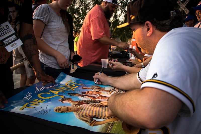 Shane Obedzinski signing a “Sandlot” poster at the 25th anniversary.