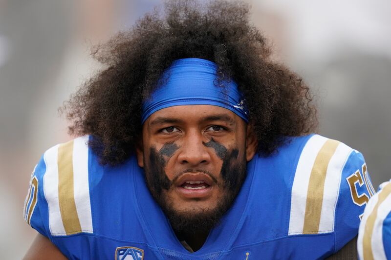 UCLA offensive lineman Tyler Manoa (50) sits on the sideline during an NCAA college football game against Alabama State in Pasadena, Calif., Saturday, Sept. 10, 2022.