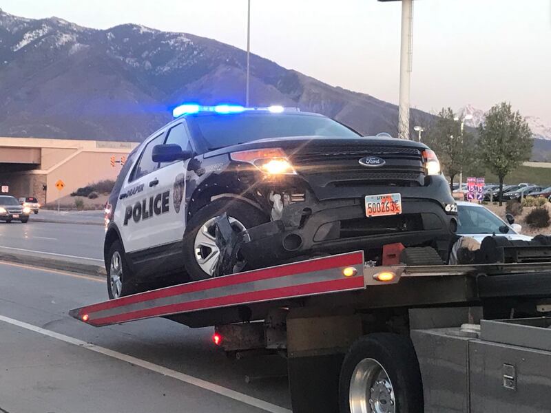 An officer responding to a shoplifting report was involved in a minor crash with another car at the southbound I-15 exit ramp of 11400 South on Tuesday, April 24, 2018.