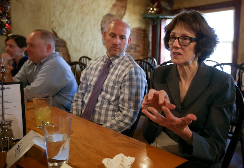Susan Combs, Interior Department's assistant secretary for policy, management and budget, chats over lunch at Roosters Brewing Co. in Ogden on Tuesday, Aug. 28, 2018. Brandon Cooper is next to her.