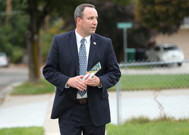 Justin Hoyal, a candidate for Salt Lake County sheriff, campaigns in Murray on Wednesday, Oct 10, 2018.