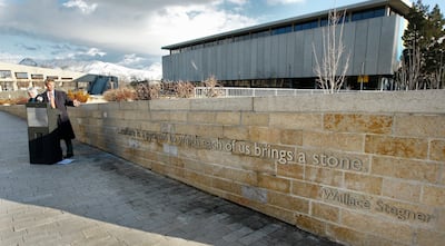 FILE - Salt Lake City Mayor Ralph Becker unveils a new addition to Library Square, an engraved quote by famed Western author Wallace Stegner, a University of Utah alumnus. Stegner, who sought to capture places in his writing that spanned the entire Americ