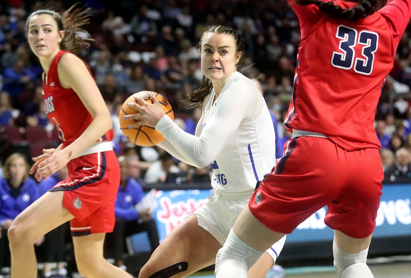 BYU forward Lauren Gustin grabs the ball during a game against Gonzaga at the Orleans Arena in Las Vegas on March 8, 2022.