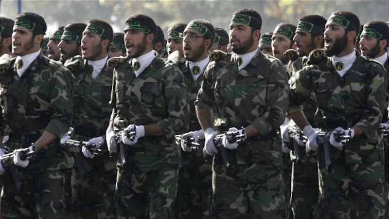 Iranian Basij paramilitary volunteers take part in a parade ceremony to remember the Iran-Iraq war (1980-88).