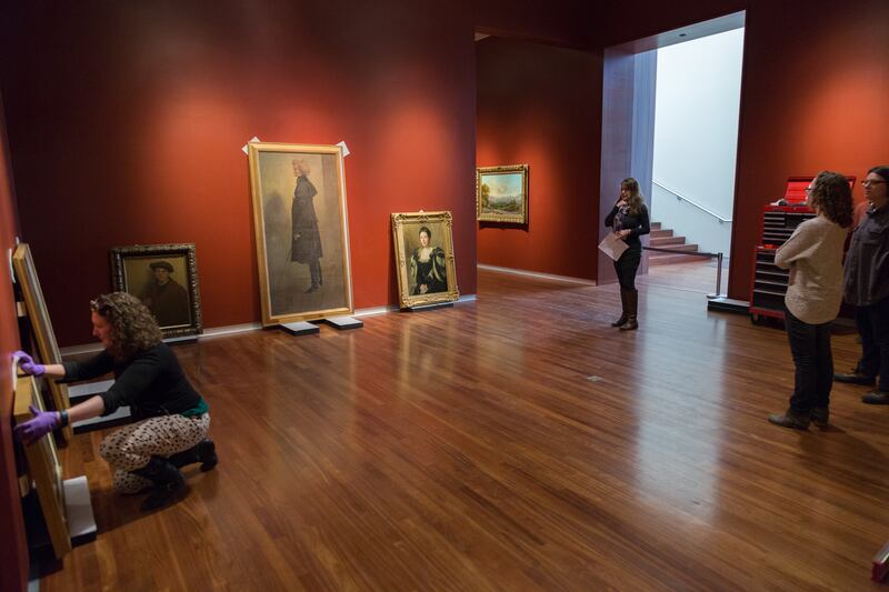 Utah Museum of Fine Arts curator Leslie Anderson directs the reinstallation of the museum's American and regional galleries in the summer of 2017.