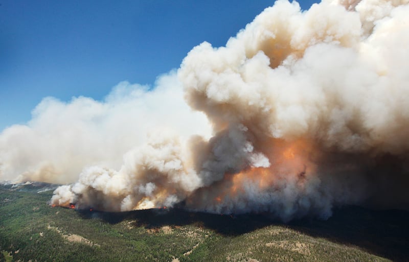 FILE - The Brian Head Fire continues to grow and burn more than 27,700 acres, Friday, June 23, 2017 in Brian Head, Utah. Attorneys for a cabin owner charged with accidentally starting the massive Brian Head Fire are seeking to show that firefighters and f