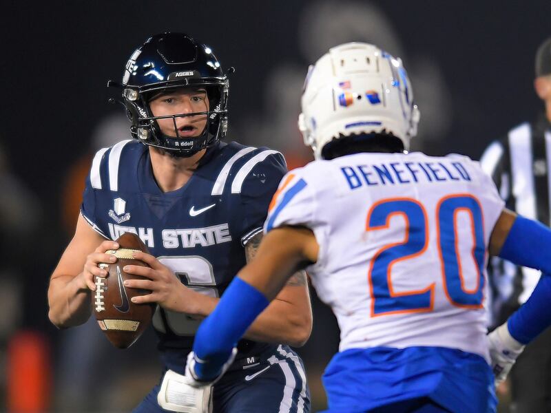 Utah State quarterback Levi Williams (16) looks to throw the ball during a college football game on Nov. 18, 2023, in Logan.